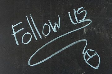 Image showing Follow us and mouse drawn on the chalkboard 