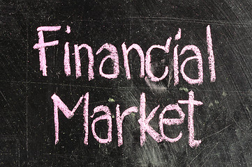 Image showing FINANCIAL MARKET handwritten with white chalk on a blackboard