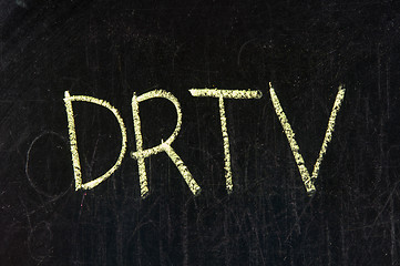 Image showing The word DRTV handwritten with chalk  on a blackboard 