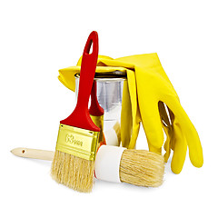 Image showing Brushes with yellow gloves and a jar