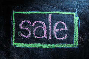 Image showing Sale handwritten with white chalk on a blackboard 