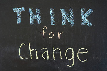 Image showing Think for change concept, words on blackboard 