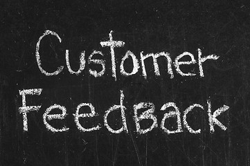 Image showing Chalk drawing -CUSTOMER FEEDBACK word written on chalkboard 