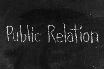 Image showing Chalk drawing -Public Relation word written on chalkboard 