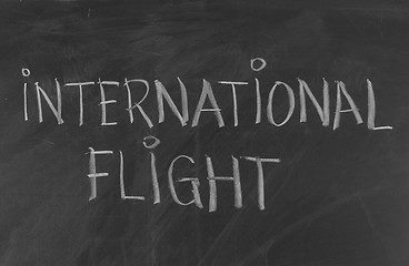 Image showing Chalk drawing - INTERNATIONAL FLIGHT word written on chalkboard 