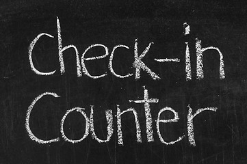 Image showing Check-in Counter written on blackboard background high resolution 