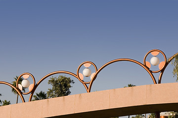Image showing Unique Brass Lighting along the Bridge