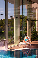 Image showing girl on a sun lounger
