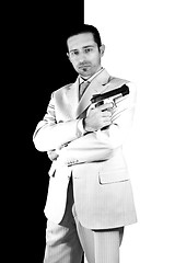 Image showing Mafia with arms crossed and a gunon hand