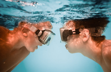 Image showing Teenagers under water