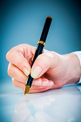 Image showing Woman's hand and pen