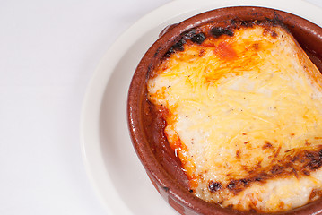 Image showing Portion of lasagna in a clay pot