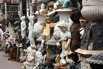 Image showing Garden figurines at the flea market. Paris, France.