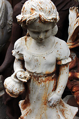 Image showing Garden figurines at the flea market. Paris, France.