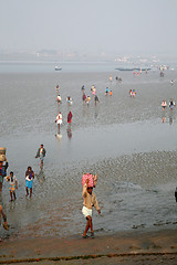 Image showing During low tide the water in the river Malta falls so low that people walk to the other shore in Canning Town