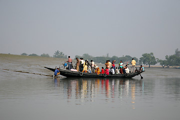 Image showing Wooden boat crosses the Ganges River