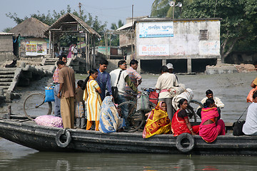 Image showing Wooden boat crosses the Ganges River