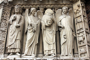 Image showing Emperor Constantine, an angel, Saint Denis holding his head, and another angel