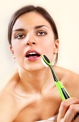 Image showing woman with tooth-brush