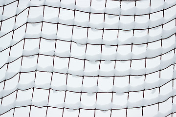 Image showing Football goal net, covered with snow