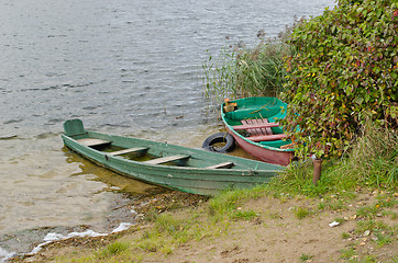 Image showing wooden boats full water moored lake shore autumn 