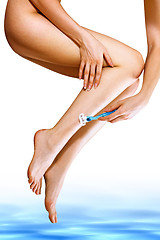 Image showing woman shaves her feet