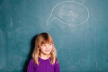 Image showing Young girl and idea bubble on chalkboard