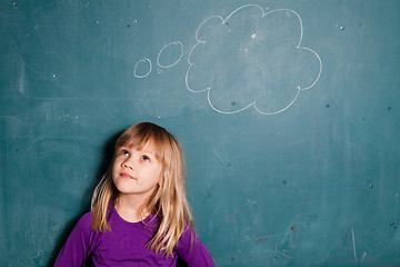 Image showing Young girl and idea bubble on chalkboard