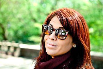 Image showing Redhead Woman Wearing Sunglasses