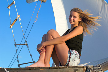 Image showing teen girl sitting at stern of the ship