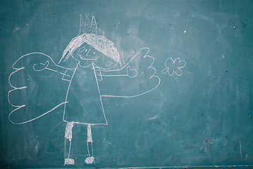 Image showing Drawing of angel princess on chalkboard by child