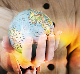 Image showing Globe in a girl's hands