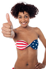 Image showing Stars and stripes bikini model showing thumbs up