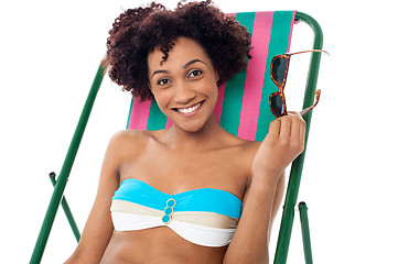 Image showing Glamorous woman in lingerie relaxing on a deckchair