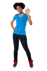 Image showing Pretty female model gesturing perfect sign