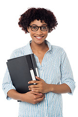 Image showing Secretary holding business files, expressing excitement