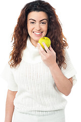 Image showing Elegant woman holding fresh green apple