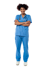 Image showing Cheerful nurse posing with arms crossed