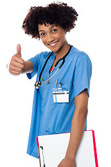 Image showing Happy lady doctor showing thumbs up sign