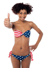 Image showing United States flag bikini model gesturing thumbs up