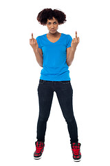 Image showing Annoyed young female showing middle finger
