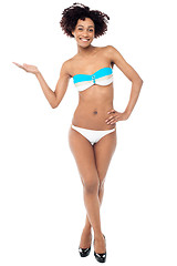 Image showing Glamorous woman in swimwear presenting copy space