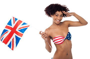 Image showing Hot American bikini model saluting and waving UK flag
