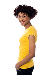 Image showing Pretty woman wearing yellow top and jeans