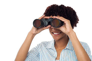 Image showing Woman watching through binoculars