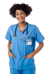 Image showing Friendly female doctor smiling isolated over white