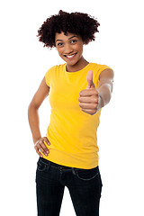 Image showing Happy smiling lady showing thumbs up gesture