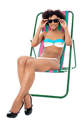 Image showing Fashion lingerie model relaxing on deckchair