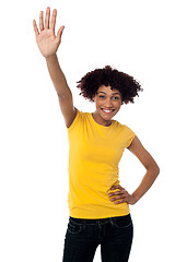 Image showing Stylish female waving her hand at you