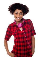 Image showing Stylish teenager with headphones around her neck